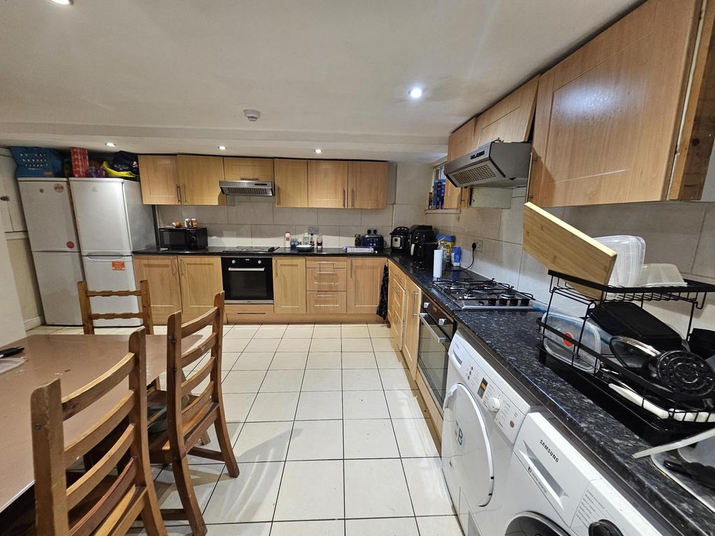 A bright and well-maintained kitchen with moder...