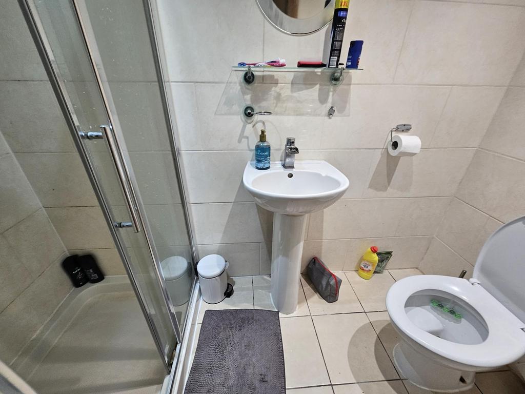 A clean and well-maintained bathroom featuring ...