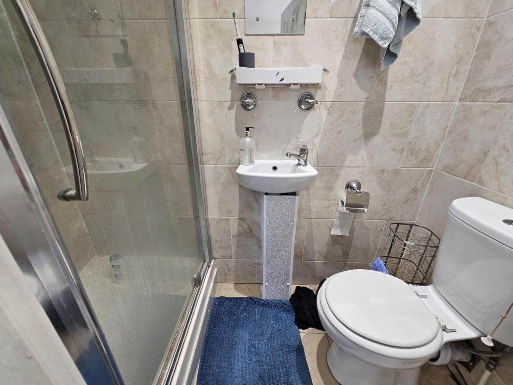 A clean and well-maintained bathroom with a sin...