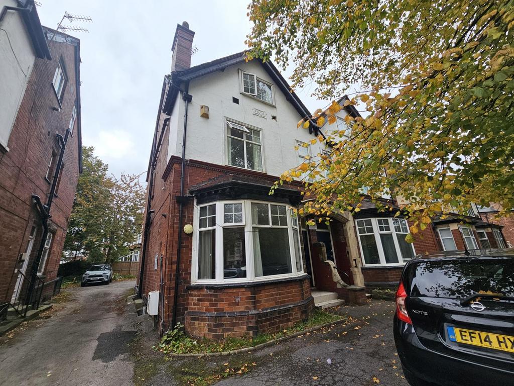 Exterior view of a traditional brick house with...
