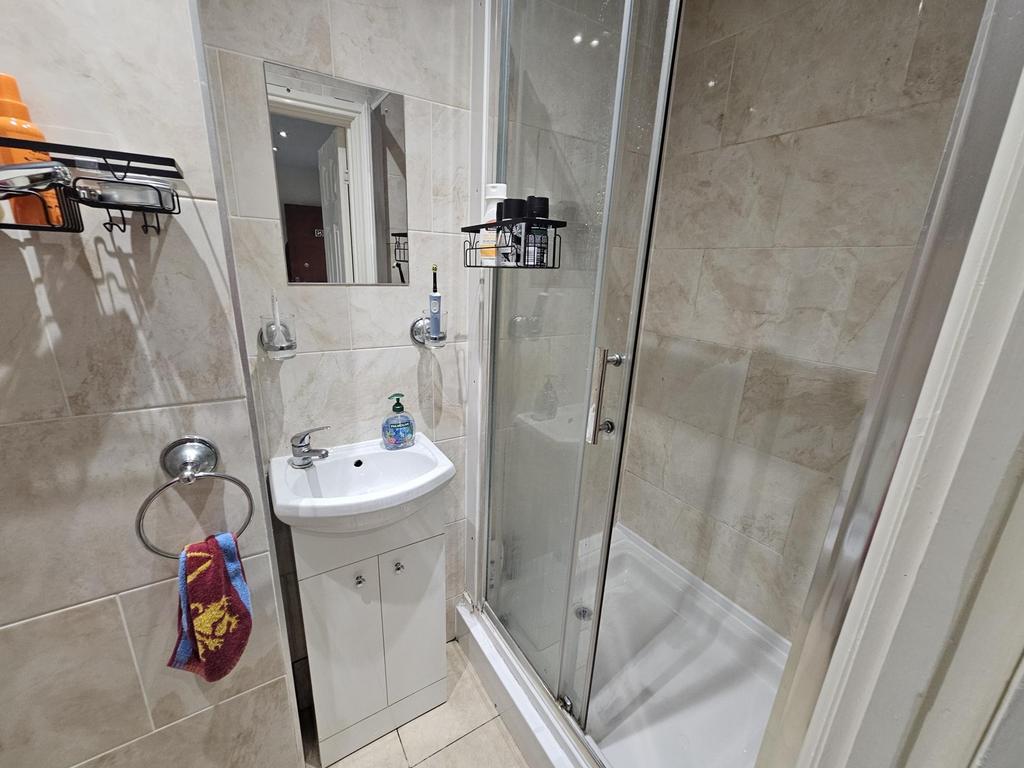 A clean and well-maintained bathroom featuring ...