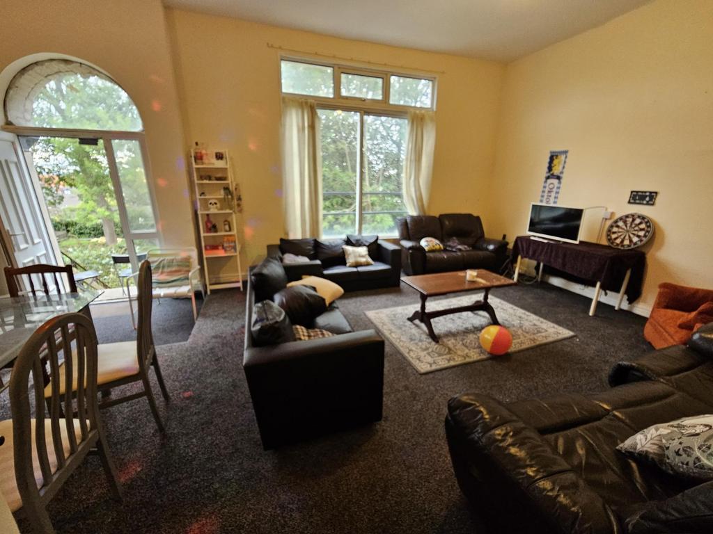 A spacious and inviting living room featuring c...