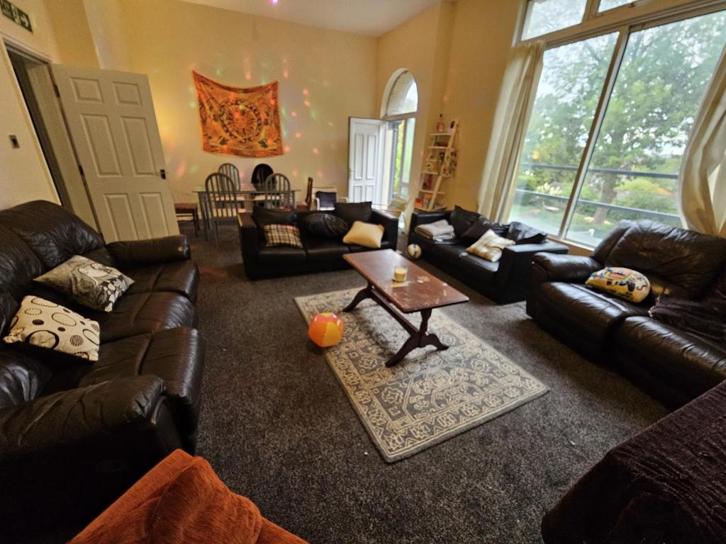 A spacious and inviting living room filled with...