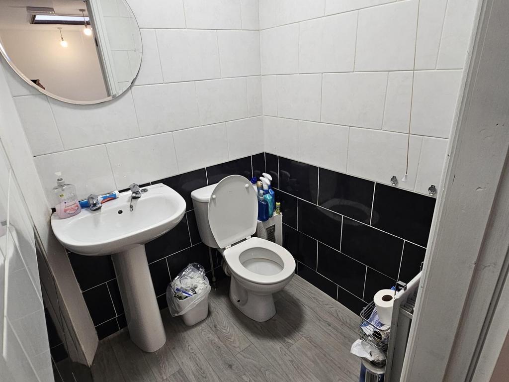 A clean and spacious bathroom featuring a large...