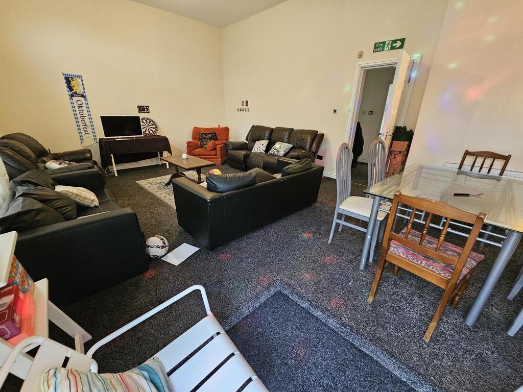 A spacious and well-maintained living room feat...