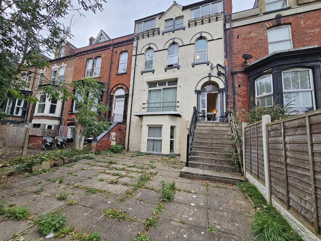 Exterior view of a charming terraced house feat...