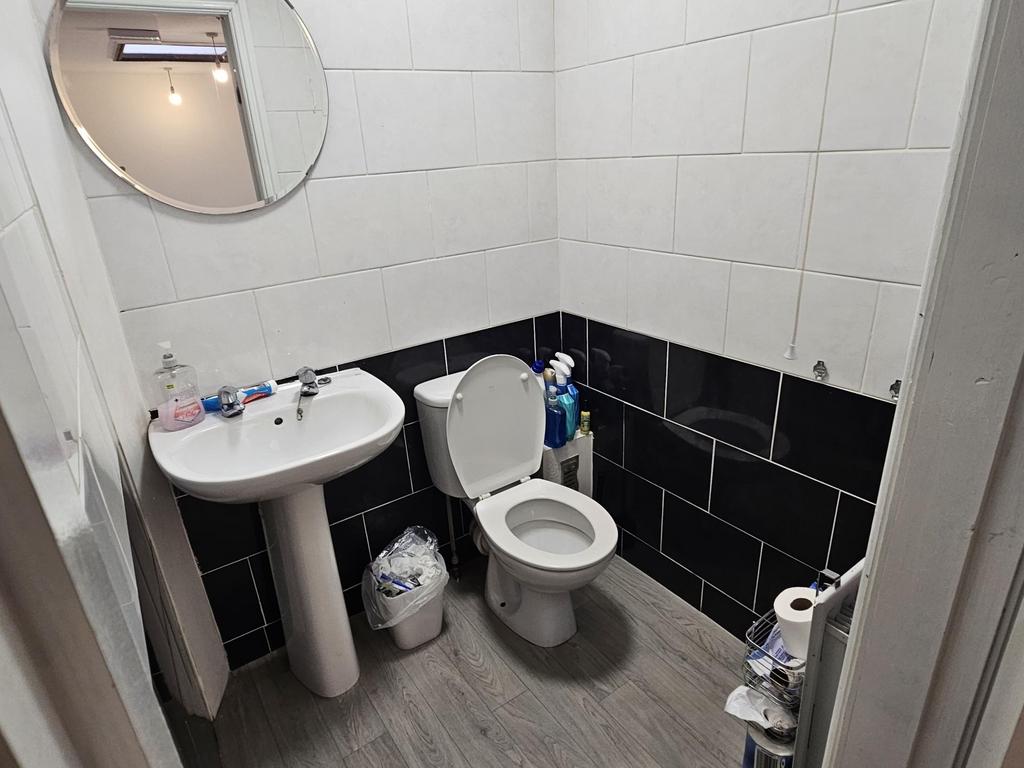 A bright and clean bathroom featuring a sink, t...