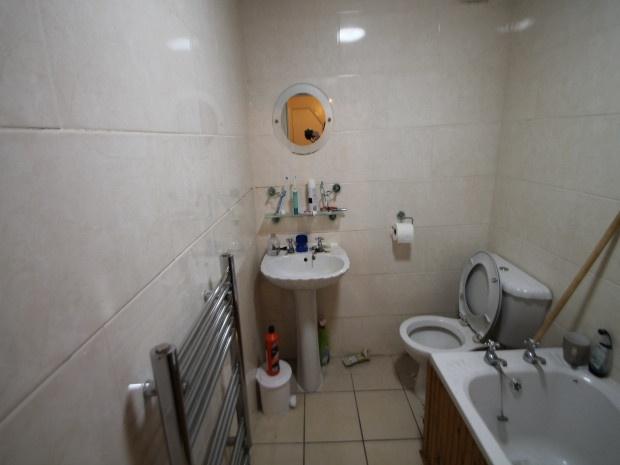 A clean and functional bathroom featuring a bat...