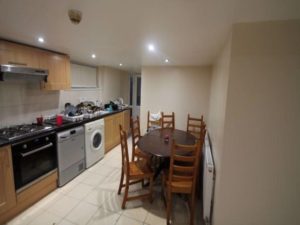 Bright and modern kitchen area with essential a...