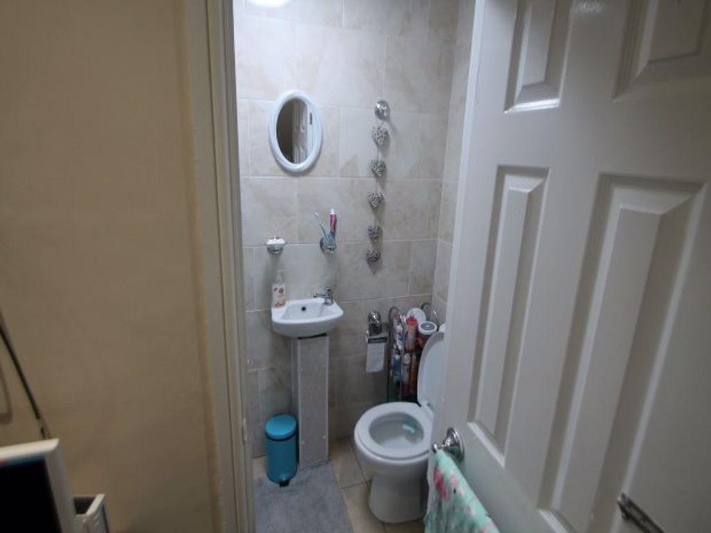 A clean and well-maintained bathroom with a toi...