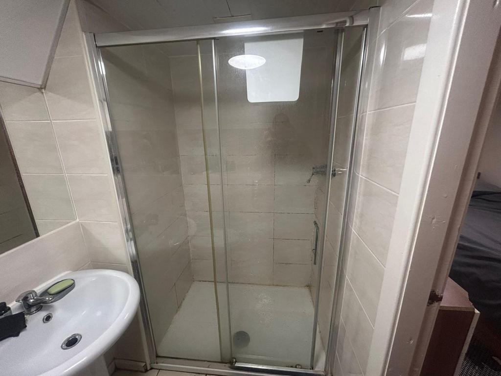 A well-maintained bathroom featuring a spacious...