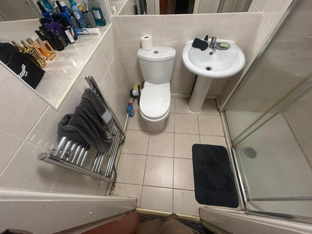 A clean, well-maintained bathroom featuring a t...