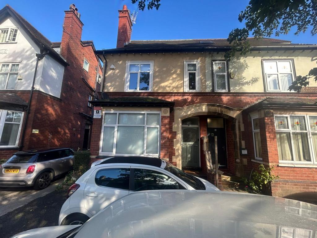 A charming exterior view of the front of a trad...