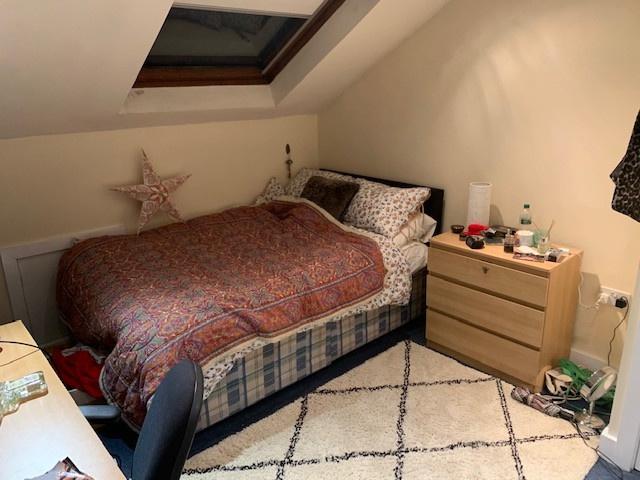 A cozy double bedroom featuring a comfortable b...