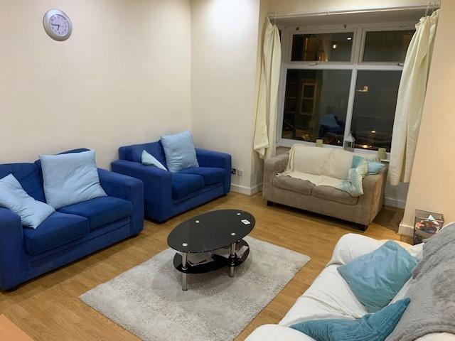 A spacious and inviting living room featuring c...