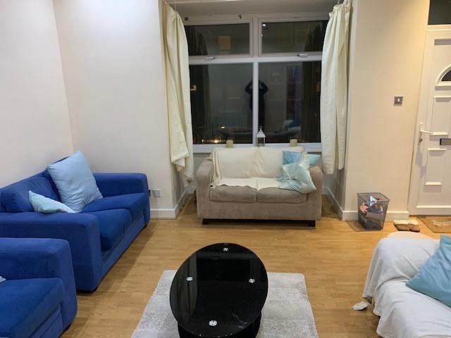 A bright and welcoming living room featuring a ...