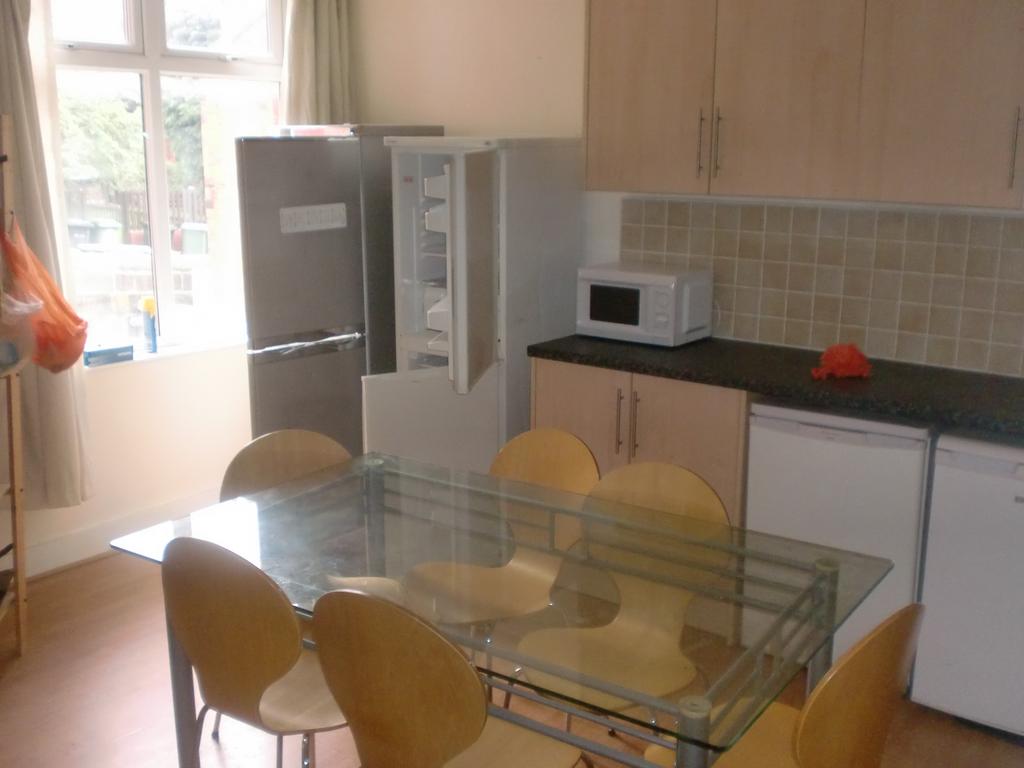 A well-lit, modern kitchen featuring ample coun...