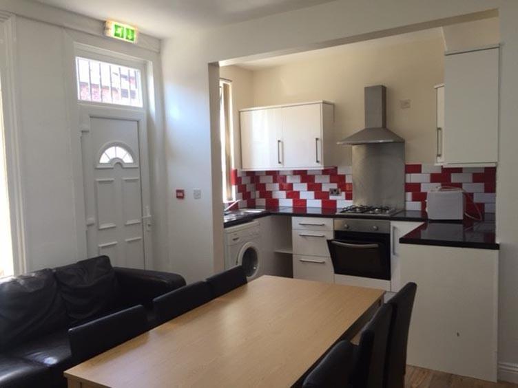Bright and well-maintained kitchen with modern ...