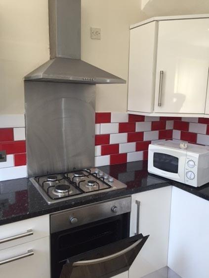 A modern kitchen area featuring a stainless ste...