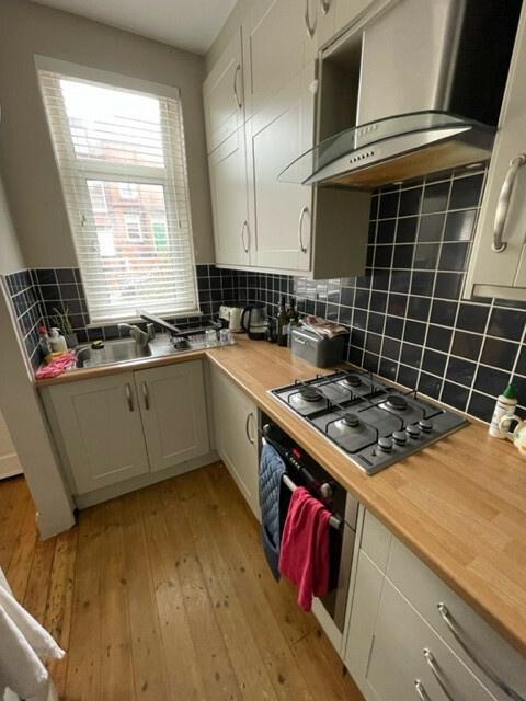 Bright and functional kitchen with ample natura...