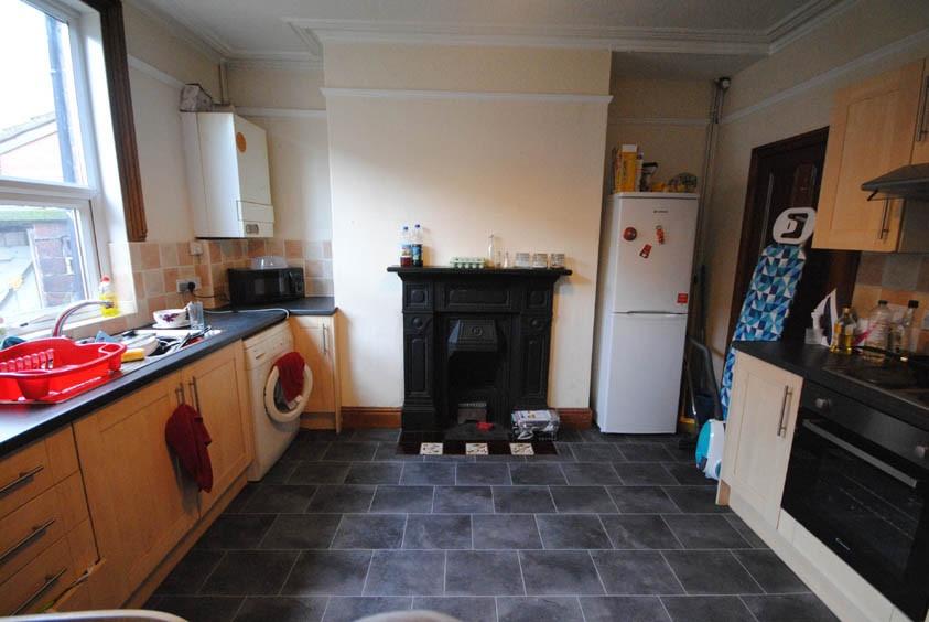 A bright and spacious kitchen featuring modern ...