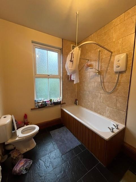 A clean and well-maintained bathroom featuring ...