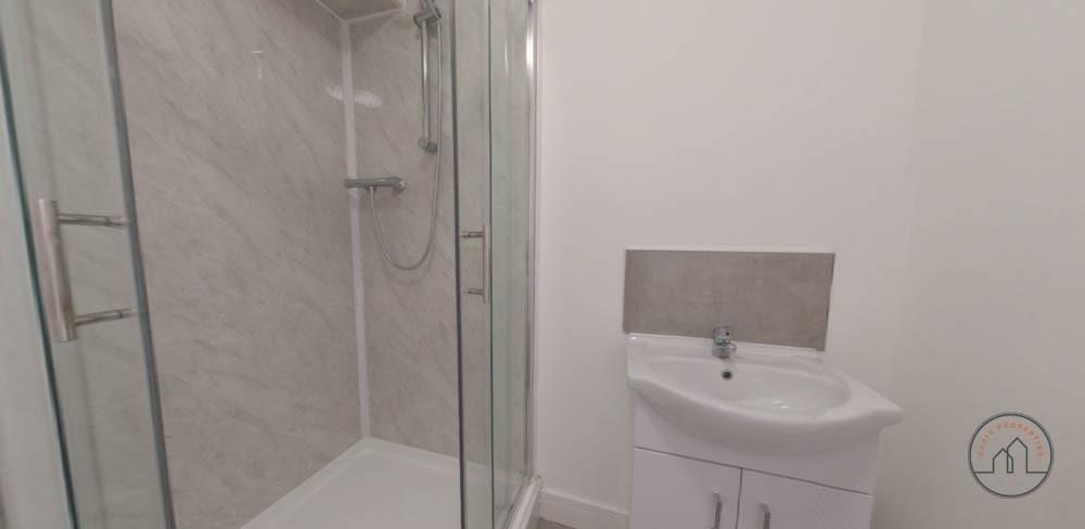 A modern and clean bathroom featuring a spaciou...