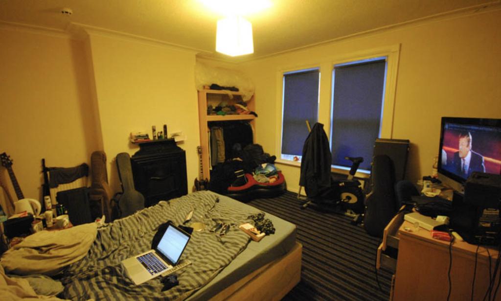 A spacious and well-lit living room featuring a...