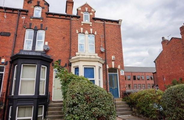 A charming brick-fronted house with a well-main...