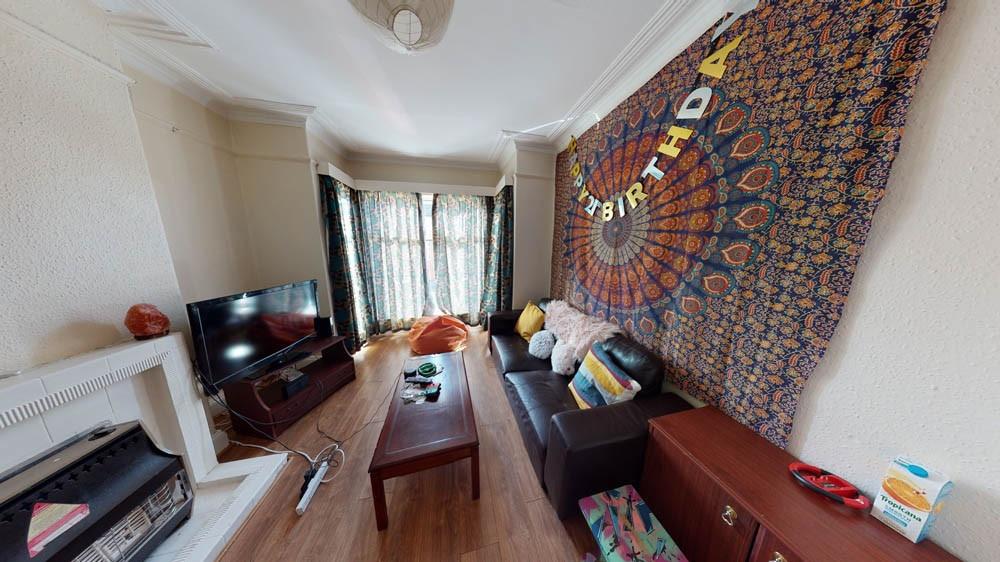 A spacious and inviting living room filled with...