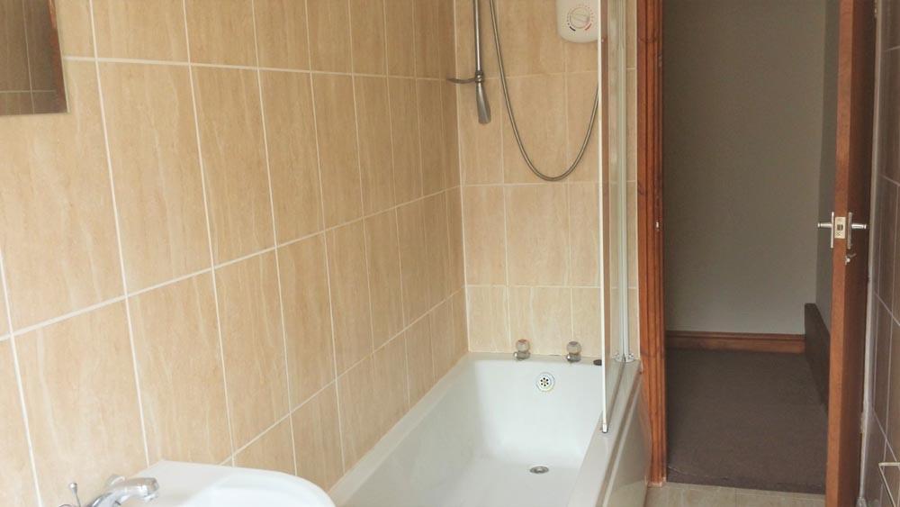 A clean and functional bathroom featuring a bat...