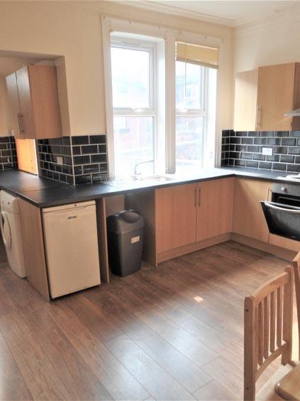 Bright and modern kitchen area featuring ample ...