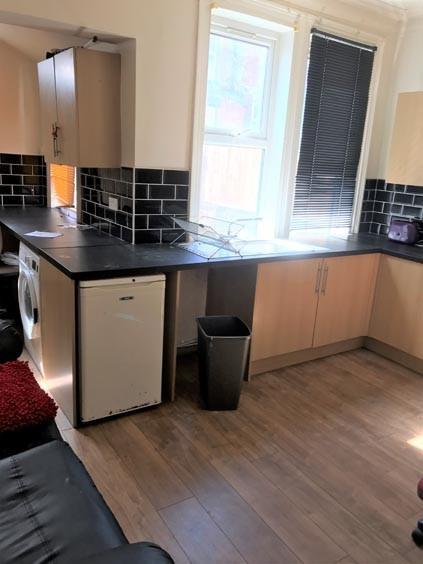A modern, well-maintained kitchen with ample na...
