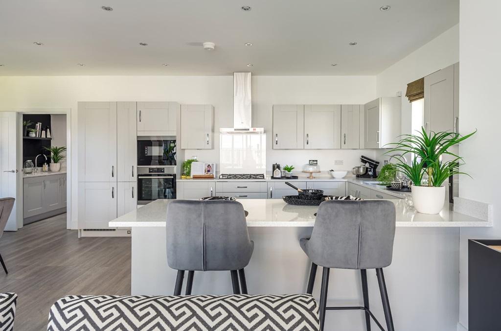 This spacious kitchen is the social hub of the...
