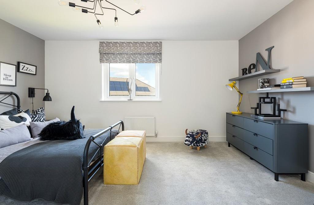 Bedroom 4 enjoys a view over the rear garden
