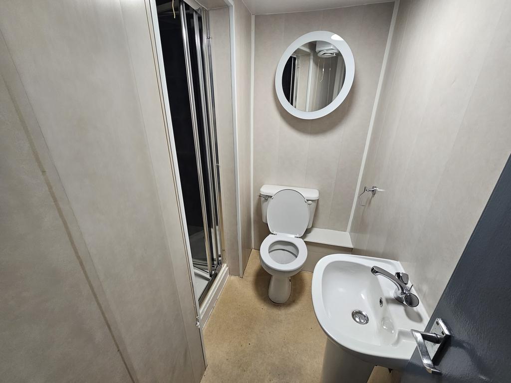 A clean and modern bathroom featuring a sink, t...