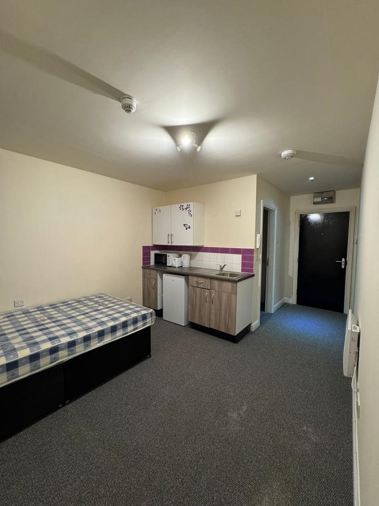 A spacious and functional living area with a sm...