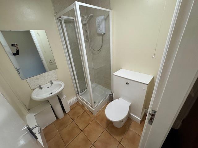 A compact yet functional bathroom featuring a s...