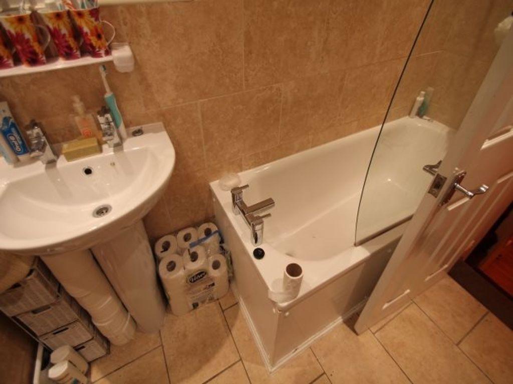 A clean and well-maintained bathroom featuring ...