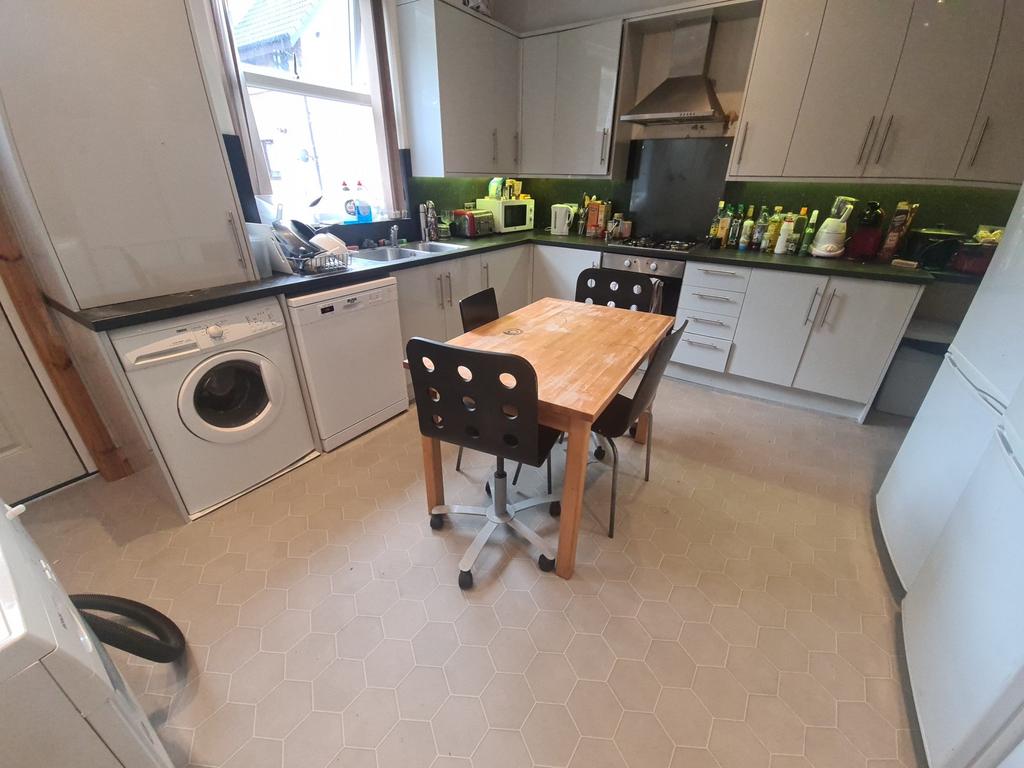 A bright and functional kitchen featuring a sma...