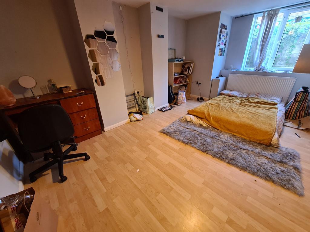Bright and spacious master bedroom featuring a ...