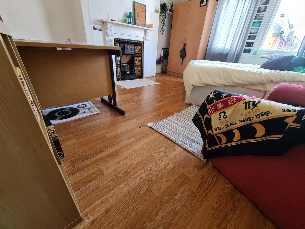 A cozy living room featuring a comfortable sofa...