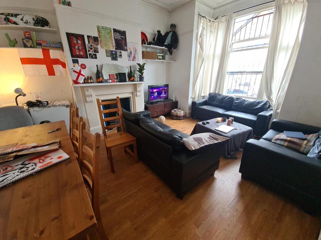 Spacious and welcoming living room featuring mo...