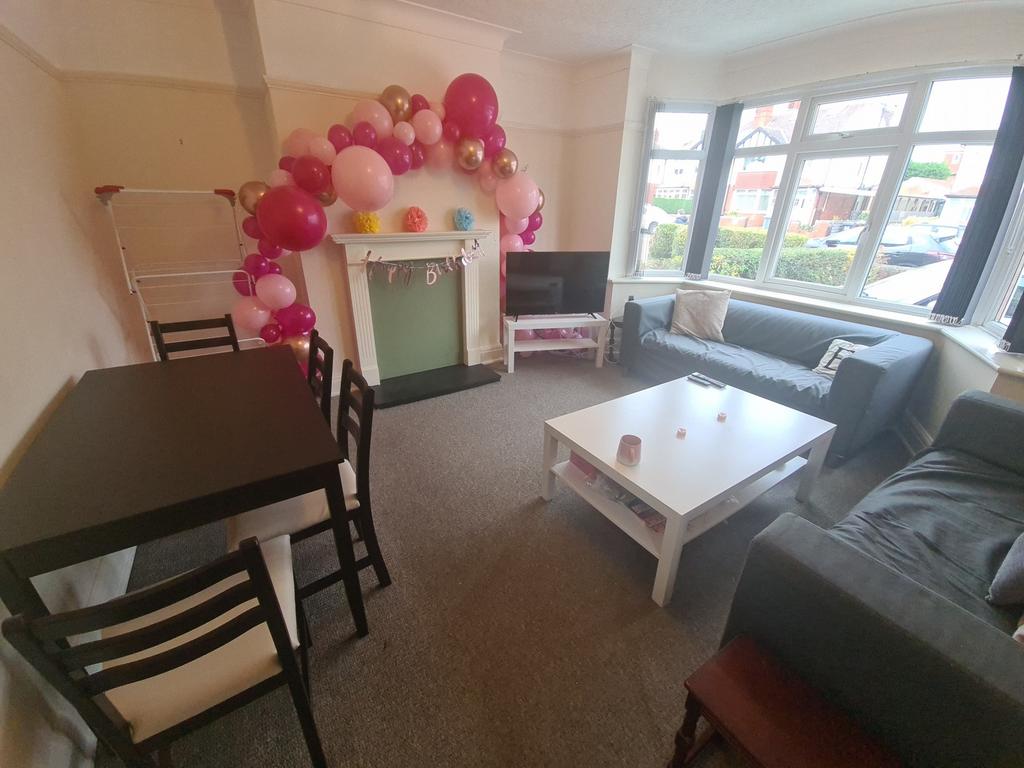 A cozy and well-maintained living room with amp...