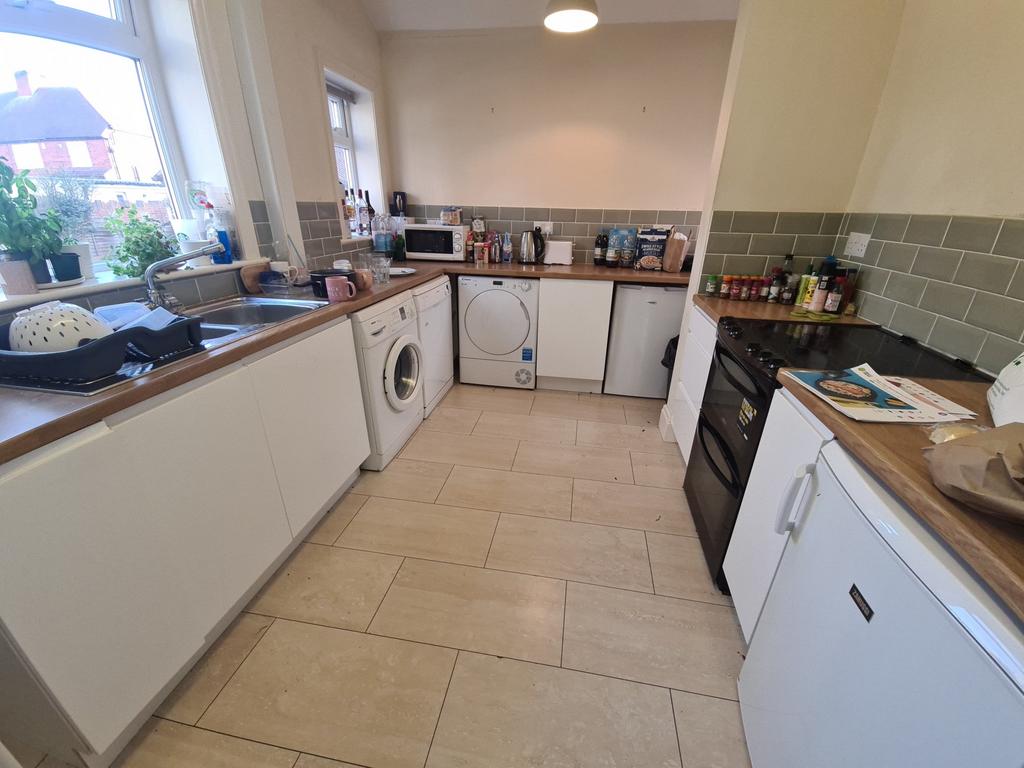 A well-maintained kitchen area with ample count...