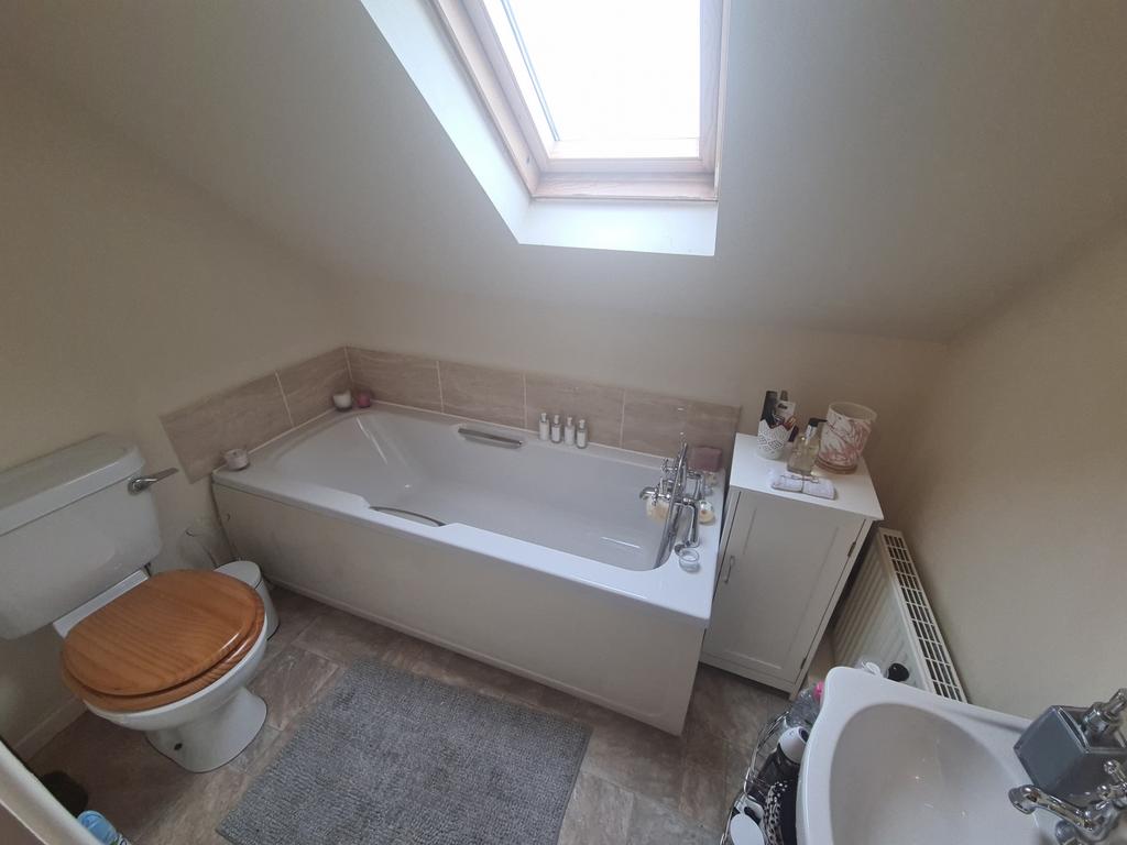 A spacious and well-maintained bathroom with a ...