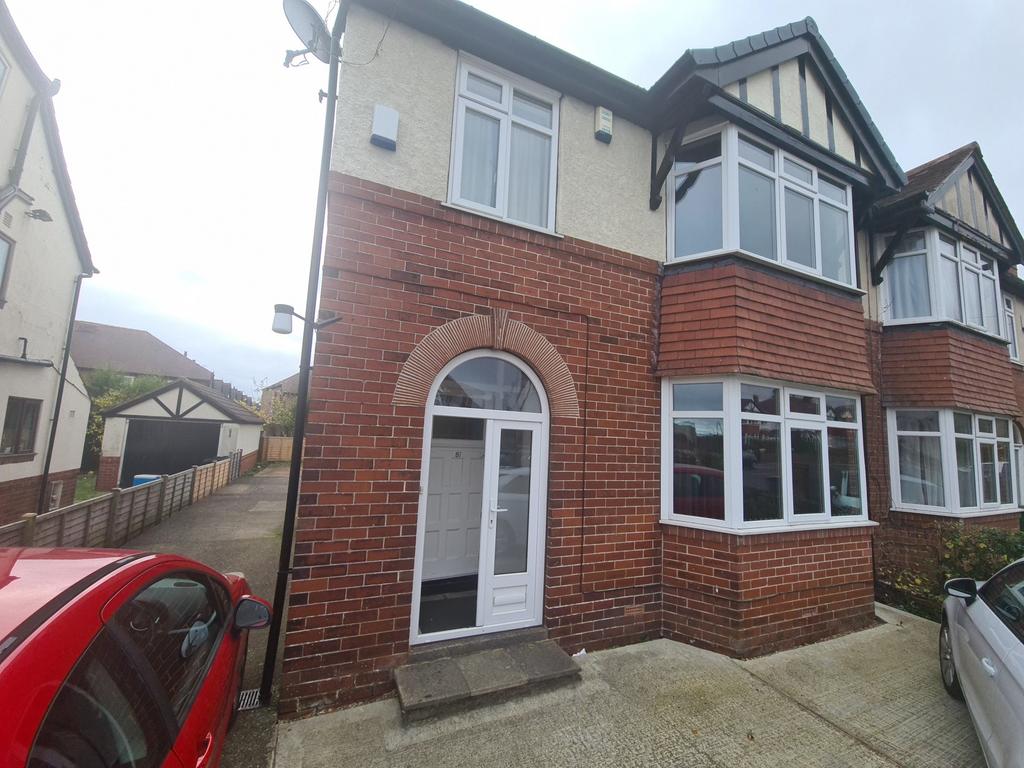 A charming front view of a traditional brick pr...
