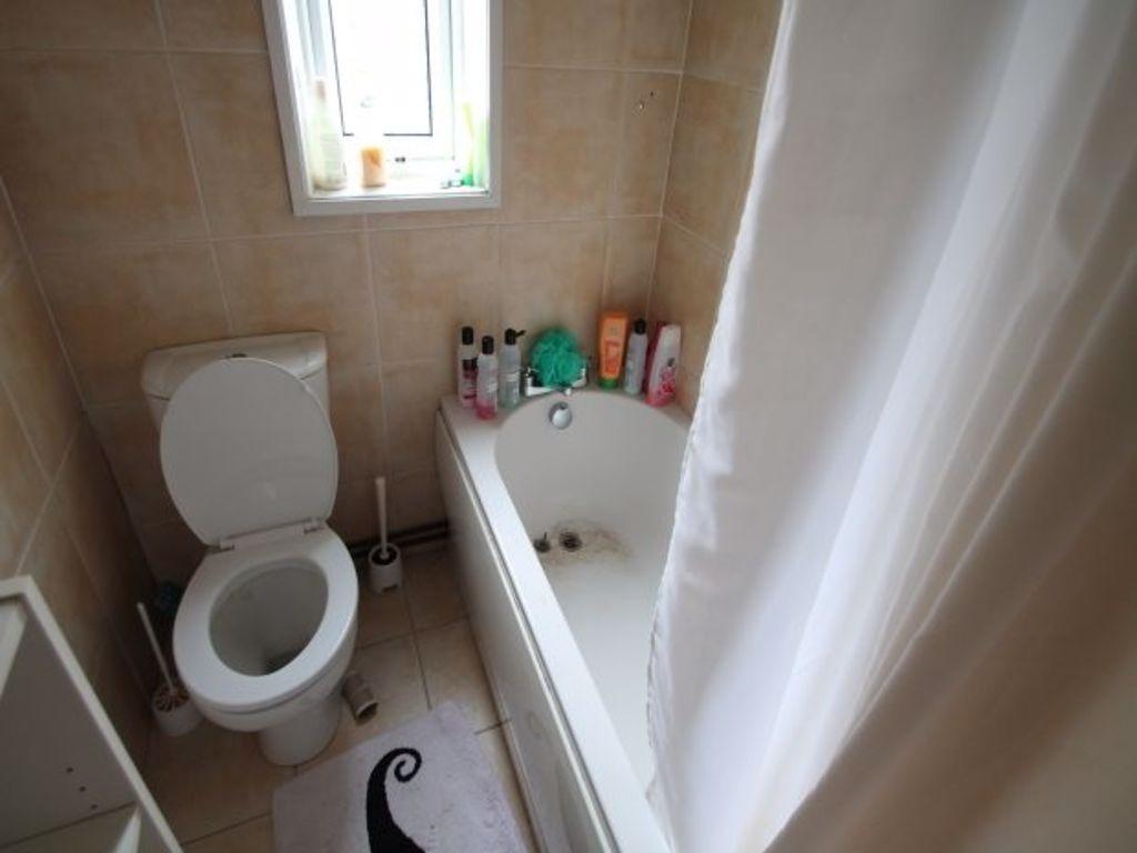 A clean, well-maintained bathroom featuring a t...