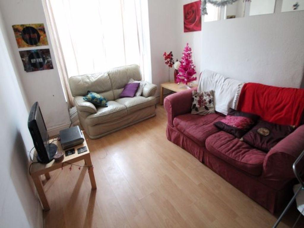 Bright and inviting living room featuring comfo...