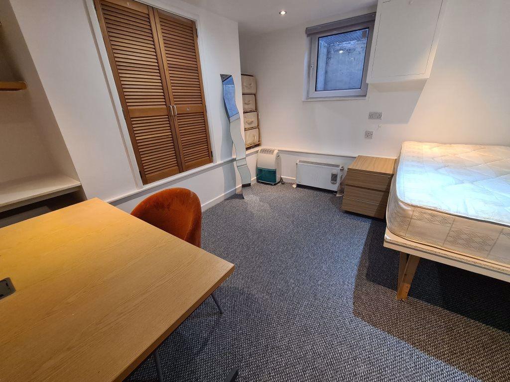 A well-maintained, bright living area with a co...